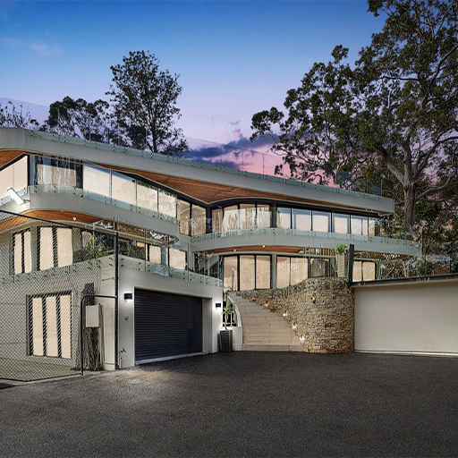Multi-level luxury residence with curved balconies and stone detailing