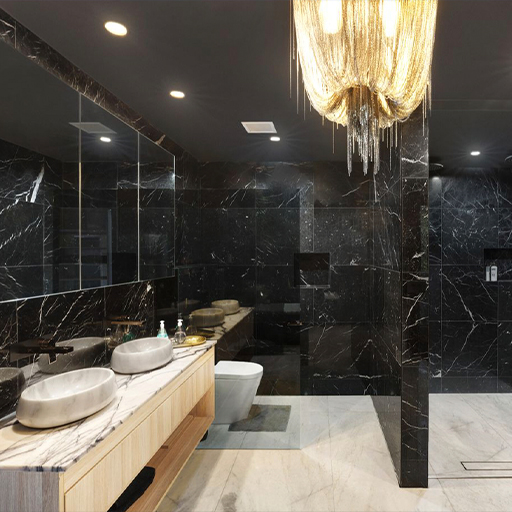 Black marble ensuite with twin stone basins