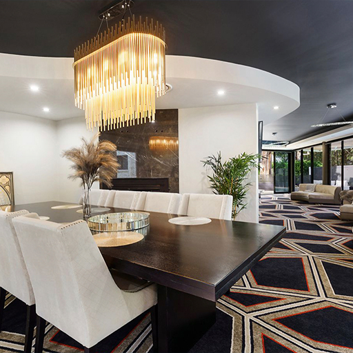 Formal dining space with feature chandelier and fireplace